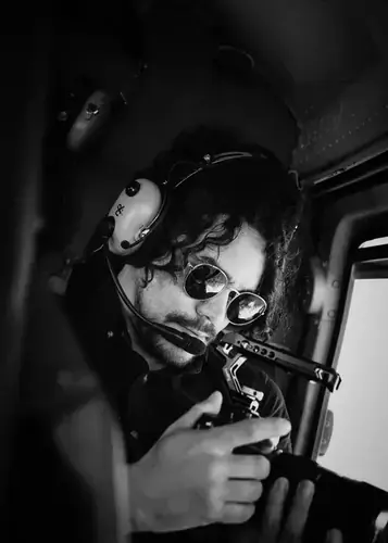 Cristian Batista in helicopter cockpit — aerial operations New Zealand
